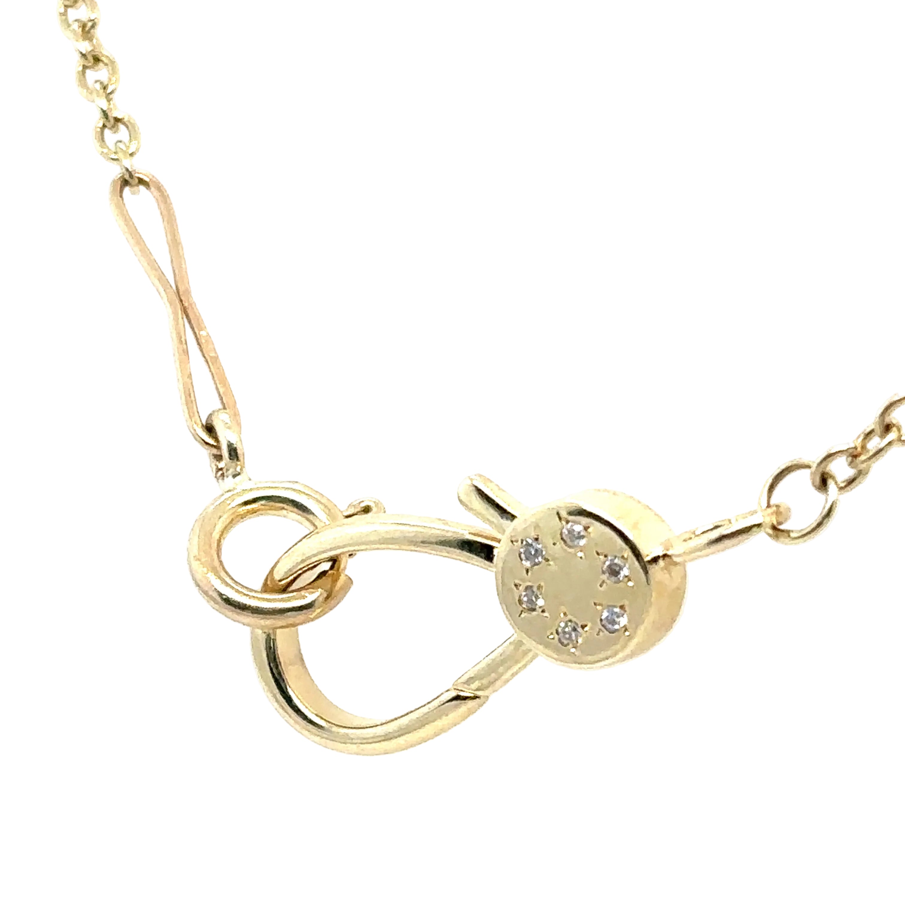 Gold necklace with a unique clasp design on a white background