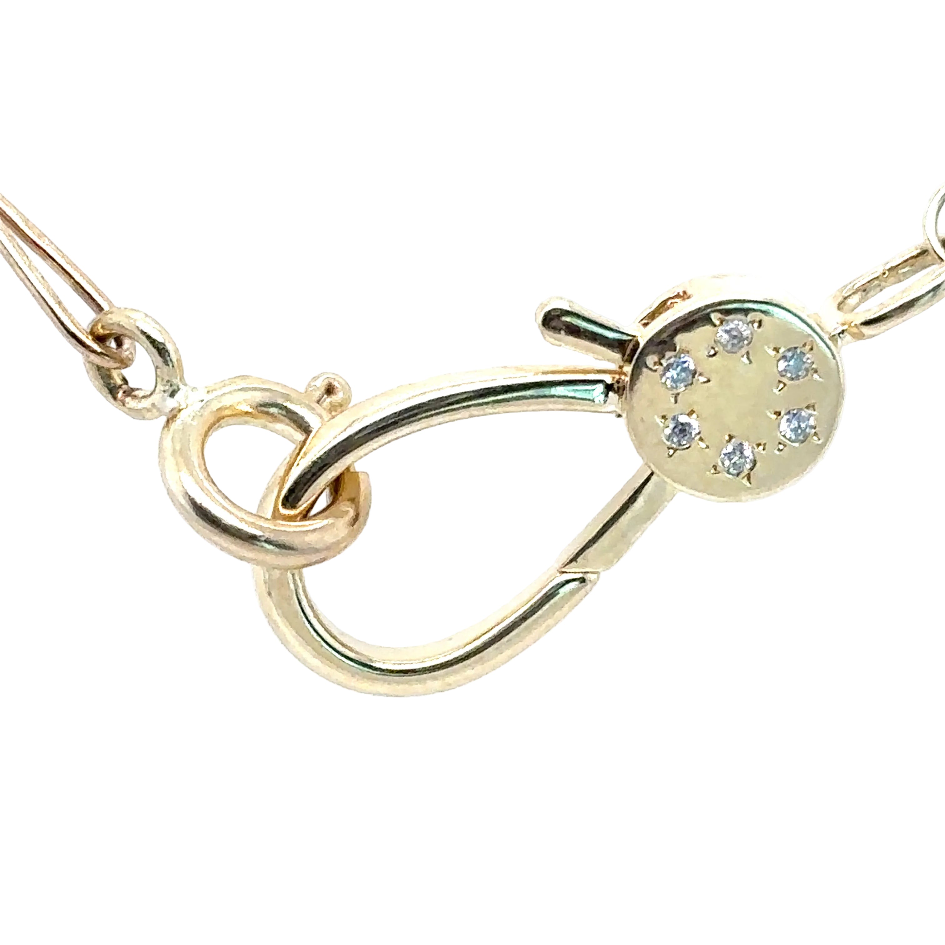 Gold necklace with a diamond clasp on a white background