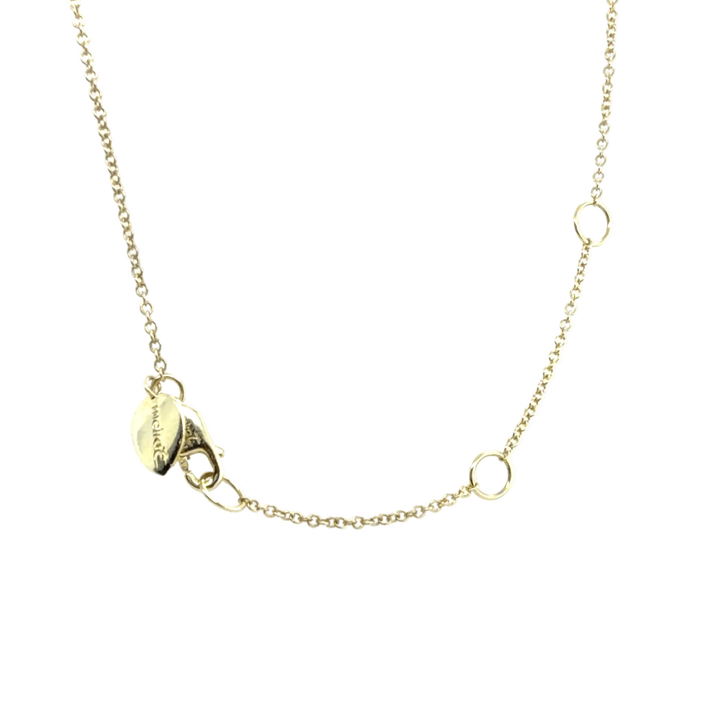 Meira T necklace photo featuring a clasp with small engraved Meira T charm and two adjustable sliding ring extensions, shown against a plain white background.