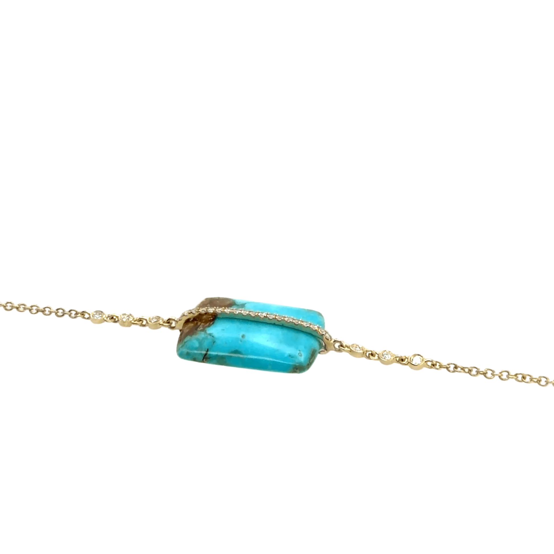 A gold chain bracelet by Meira T featuring a rectangular turquoise stone with natural brown matrix, wrapped horizontally by a thin gold band of small clear stones.